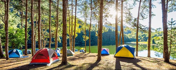 Scenic lakeside campground site at sunset
