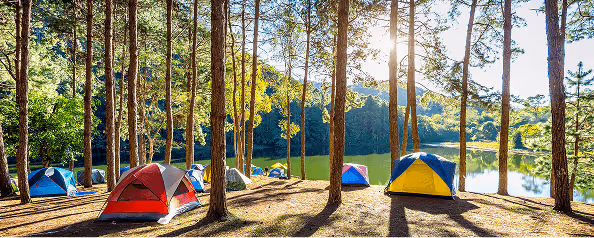 Scenic lakeside campground site at sunset