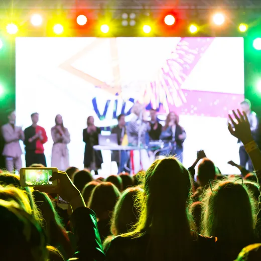 Crowd enjoying a live concert at night